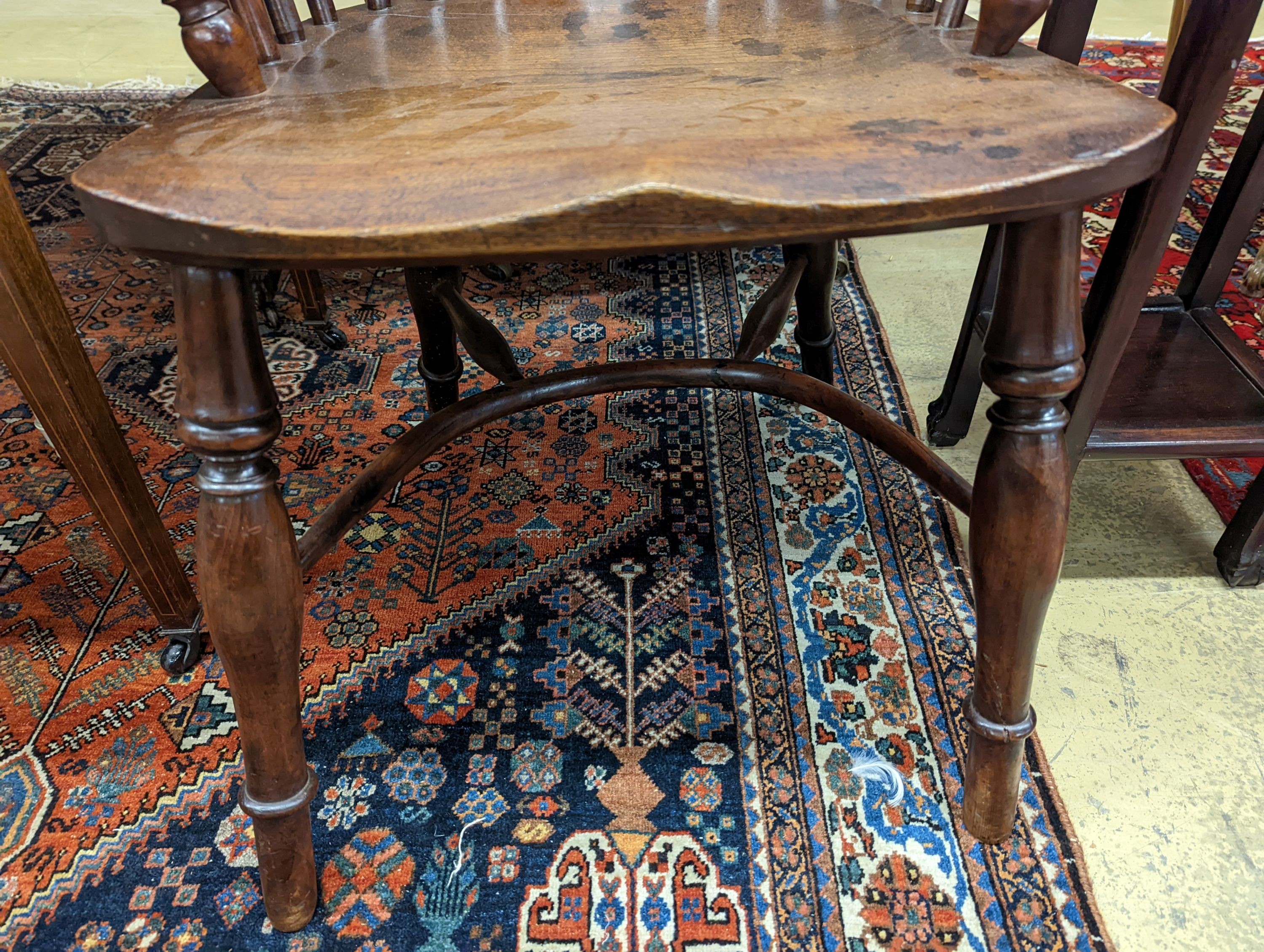 A mid 19th century Windsor yew and elm Windsor elbow chair, width 58cm, depth 42cm, height 91cm